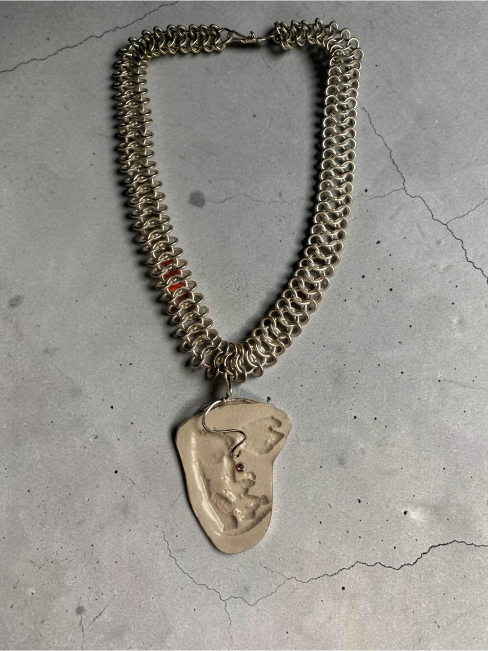 Handcrafted Metallic Silver Chain Necklace with Abstract Pendant
